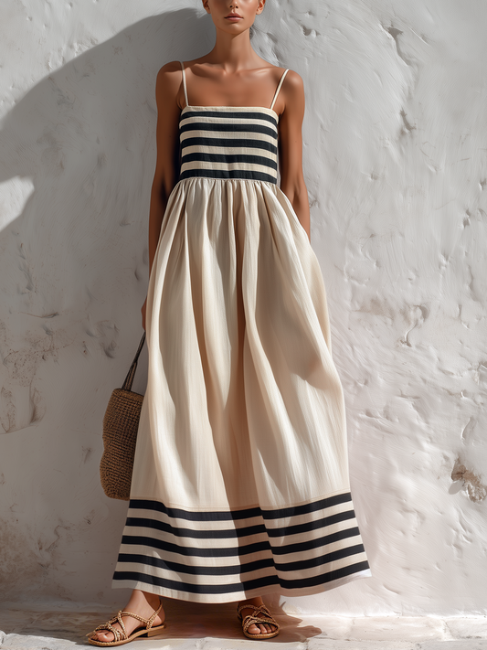 Ortensia — Vestido largo de rayas negras y beige con tirantes finos.